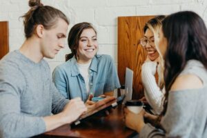 A group of friends talking in a cafe