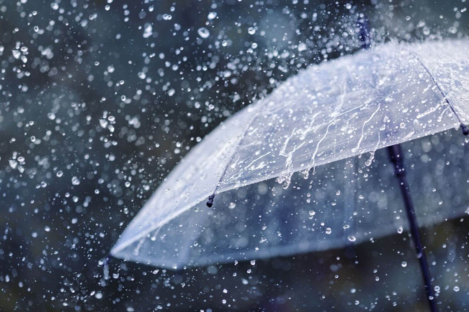 Rain splashing on a transparent umbrella