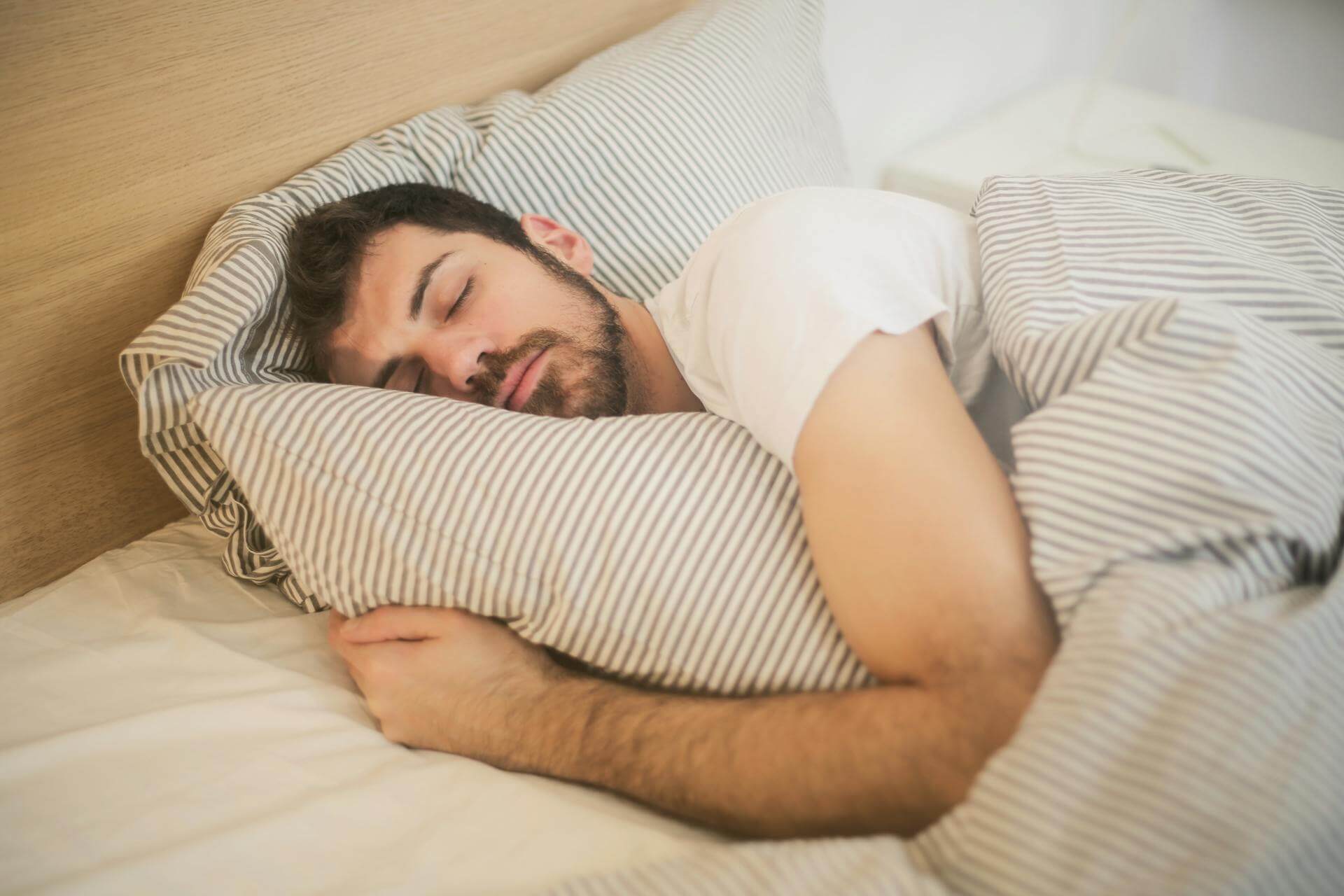 A bearded man sleeping